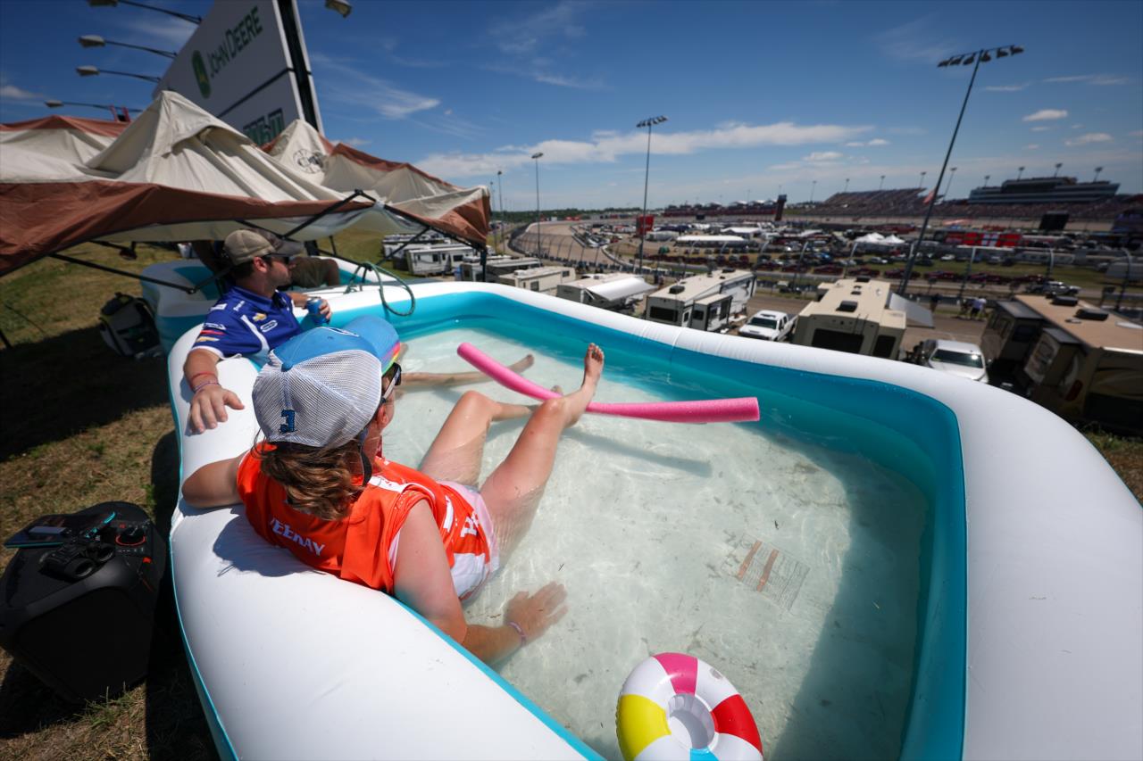 Fans hanging out in a pool watching IndyCars - Hy-Vee Salute to Farmers 300 - By: Chris Owens -- Photo by: Chris Owens